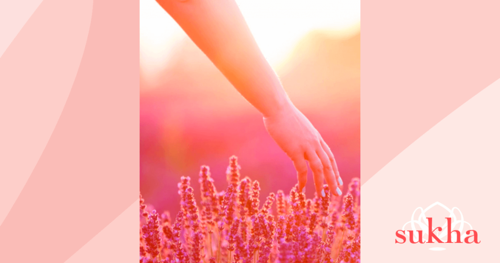 Postnatal yoga therapy woman with hand on lavender in a field